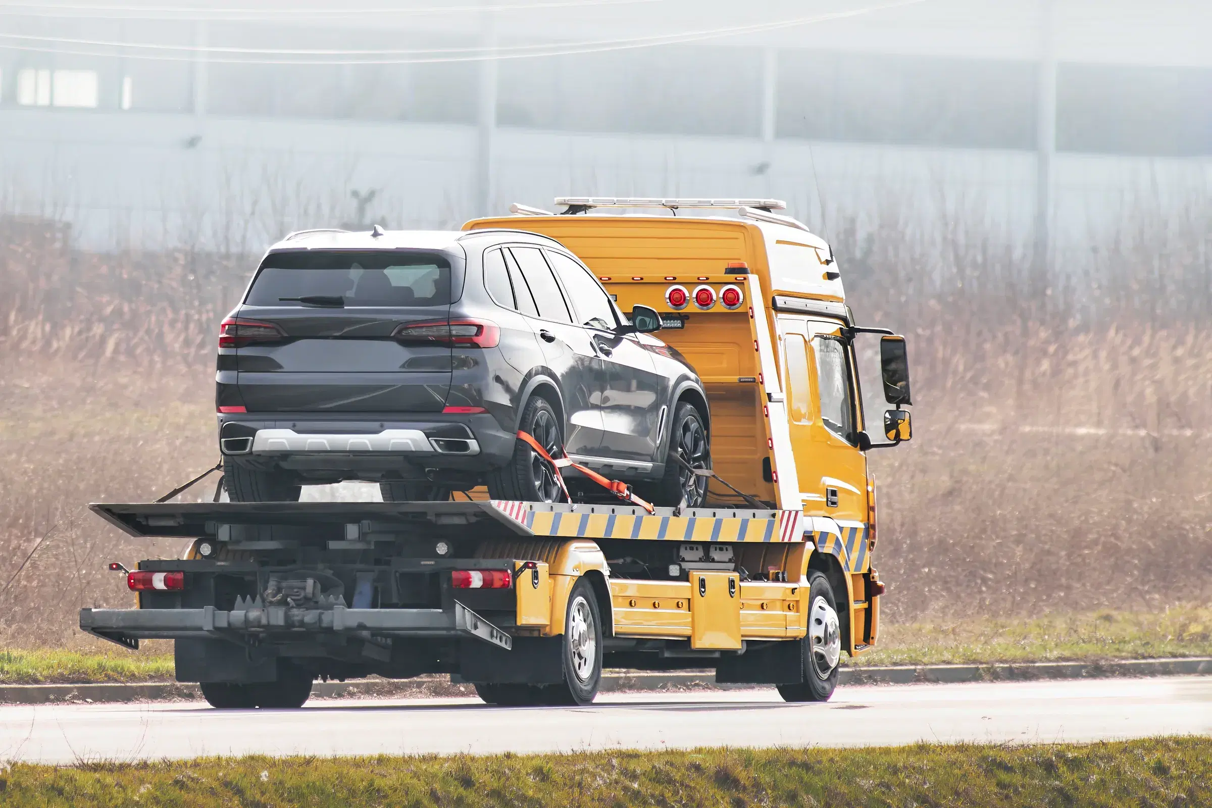 Flatbed vehicle transporter travelling between Saudi cities